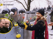 Девушка в Киеве украшает розами щиты сотрудников милиции во время Оранжевой революции