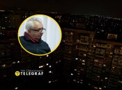 Алексей Кучеренко на фоне темного Киева