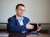 Гетманцев говорит, что нагрузка на экономику есть, но она не катастрофична