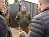 Чиновники Полтавского облсовета и ОВА на фоне отреставрированных контейнеров