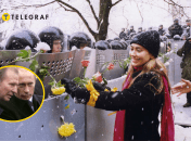 Дівчина у Києві прикрашає трояндами щити співробітників міліції під час Помаранчевої революції