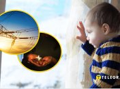 Ребенок смотрит на снег за окном