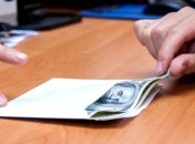 За "нужное" решение по рейдерству судья из Днепра требовал 30 тыс. долл