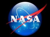 NASA показало цветные снимки Харона - крупнейшего спутника Плутона