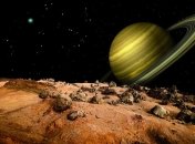 "Кассини" показал обратную сторону Сатурна и его спутника