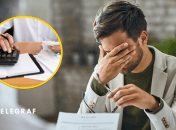 Калькулятор и мужчина, закрывший лицо рукой