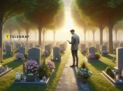 Мужчина с телефоном на кладбище