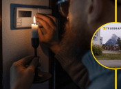 Человек со свечой возле счетчика электроэнергии