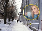 Город в снегу, женщина в окне