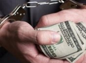 Глава РГА на Хмельниччине попался на взятке в $33 тысячи