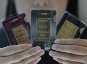 Золоті зливки 25, 50 і 100 грамів