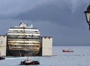 Costa Concordia буксируют в Геную, где его разберут на металлолом