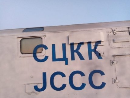 Надпись СЦКК на борту обстрелянной машины