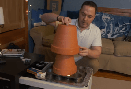 обігрівач зі свічками та горщиками