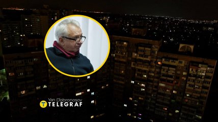 Алексей Кучеренко на фоне темного Киева