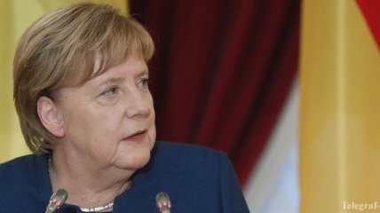 Меркель: Внутренние переселенцы должны принять участие в выборах на Донбассе