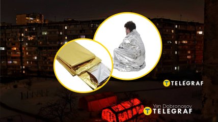 Відключення світла у Києві, чоловік у термоковдрі