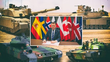 Министр обороны Польши Мариуш Блащак провел переговоры о танках на фоне флагов стран-союзников