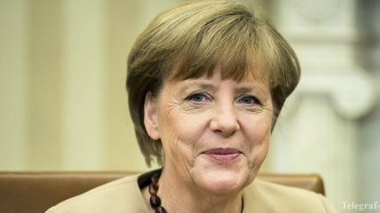 Меркель призвала Путина способствовать выборам в Украине