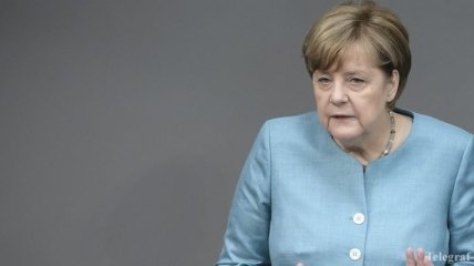 Меркель не будет посредником между РФ и США на G20