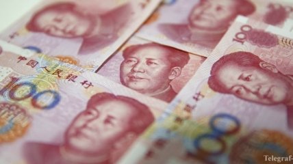 Китай снизил курс юаня