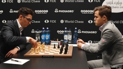 Шахматы. Карлсен и Каруана сыграли вничью в шестой партии матча за звание чемпиона мира