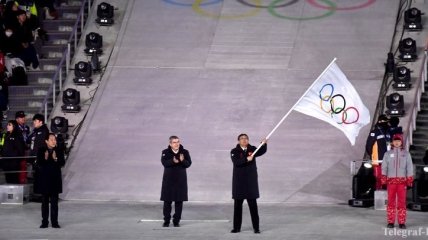 В Пекине торжественно встретили олимпийский флаг, доставленный из Пхенчхана