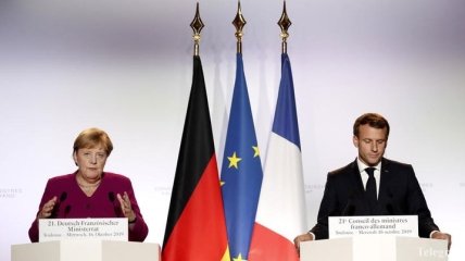 Макрон и Меркель приветствуют "позитивные сдвиги в осуществлении Минских соглашений"