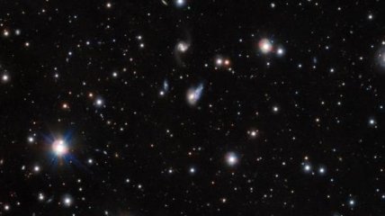 Астрономы получили снимок светового эха сливающихся галактик