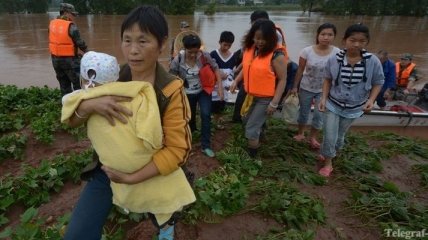 В Китае из-за сильных наводнений эвакуированы тысячи человек