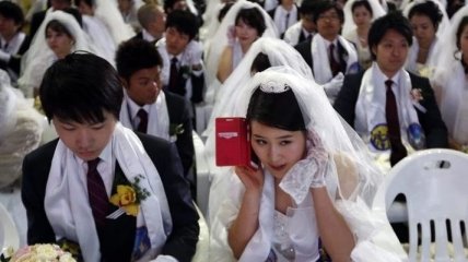 Массовая свадебная церемония с участием 5000 женихов и невест (Фото) 