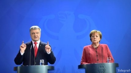 Порошенко после встречи с Меркель заявил о необходимости санкций против РФ