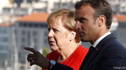 Меркель и Макрона заметили в баре в Брюсселе за пивом и картошкой фри (Видео)