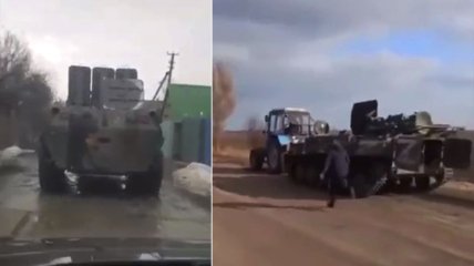 У господарстві знадобиться: українці тракторами затягують собі російські БТРи (відео)