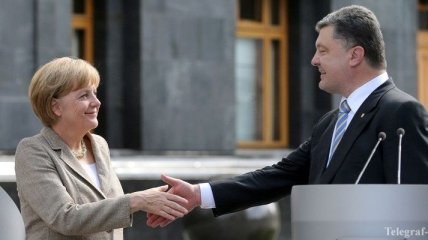 Меркель и Порошенко намерены активизировать переговоры по Донбассу