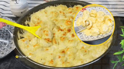 Пельмені запечені в сметанному соусі з сиром