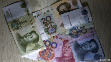Китай ослабил курс юаня до минимума