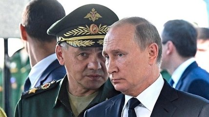 Кровавый лидер россии путин и его приспешник сергей шойгу