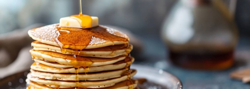 Оладки - це смачний і універсальний десерт (фото створене з допомогою ШІ)