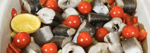 Запечений хек з овочами