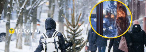 Сніжна святкова вулиця та дівчина, що дивиться у вікно